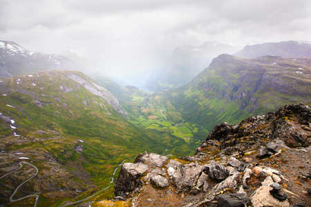 view on foggy Geiranger village from Dalsnibba viewpoint, Norwayの写真素材