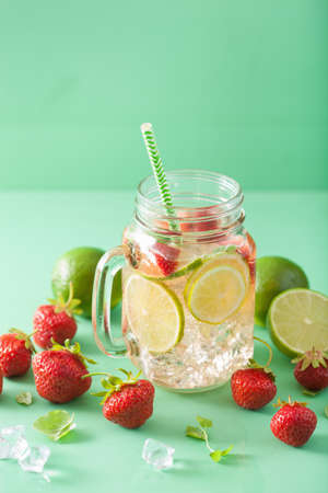 refreshing summer lemonade with strawberry and lime in mason jarの写真素材