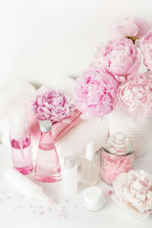 bath and spa with peony flowers beauty products towelsの写真素材