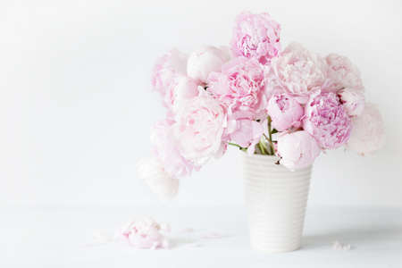 beautiful pink peony flowers bouquet in vaseの写真素材