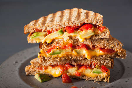 grilled cheese sandwich with avocado and tomatoの写真素材