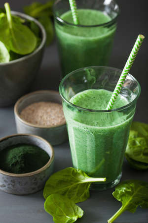 green spinach smoothie with spirulina, chia seed, lime, appleの写真素材