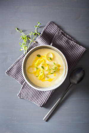 creamy potato and leek soup in bowlの写真素材