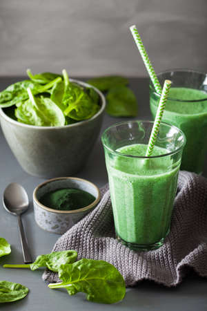 green spinach smoothie with spirulina, chia seed, lime, appleの写真素材
