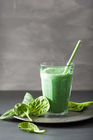 green spinach smoothie with spirulina, chia seed, lime, appleの写真素材