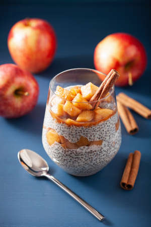 chia pudding with cinnamon simmered apples and peanut butterの写真素材