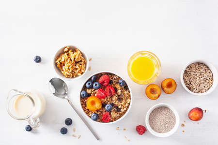 healthy granola for breakfast with berry fruit nut, vegan milkの写真素材