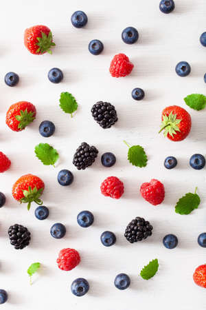 Assorted berries over white background. Blueberry, strawberry, raspberry and blackberryの写真素材