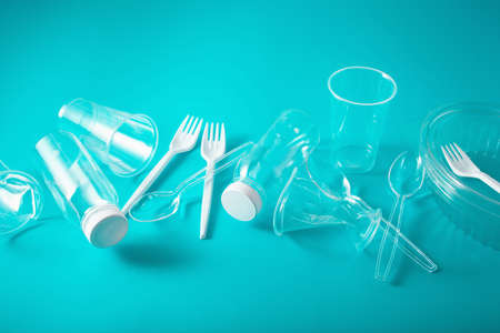 Single use plastic bottles, cups, forks, spoons. concept of recycling plastic, plastic wasteの写真素材
