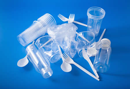 single use plastic cups, forks, spoons, bottles. concept of recycling plastic, plastic wasteの写真素材