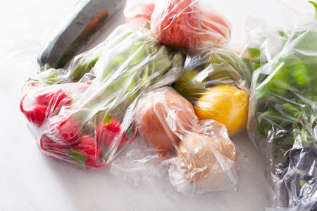 single use plastic waste issue. fruits and vegetables in plastic bags