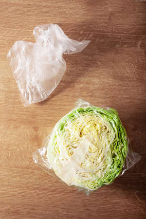 cabbage vegetable in plastic bag. single use plastic packaging issue.