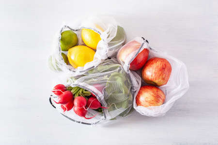 fruits and vegetables in reusable mesh nylon bag, plastic free zero waste concept