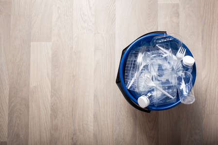 clean recyclable plastic bottles, containers, cups in garbage bin. waste management plastic reuseの写真素材