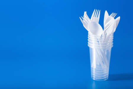 single use plastic cups, forks, spoons. concept of recycling plastic, plastic wasteの写真素材