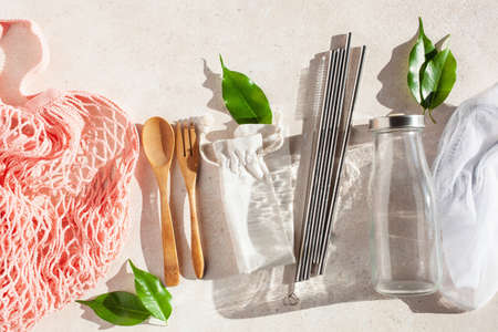 zero waste eco friendly concept. reusable cotton bag, stainless steel drinking staw, glass jar, wooden cutleryの写真素材