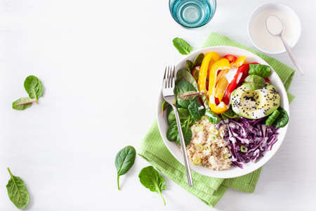 veggie couscous lunch bowl with avocado, bell peppers, spinach and red cabbage