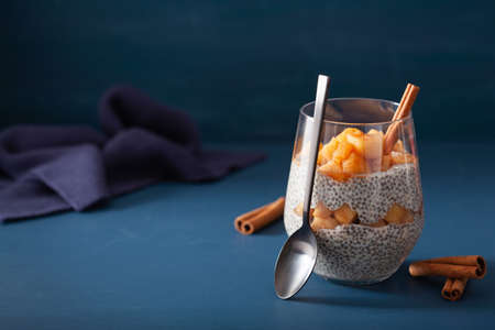 chia pudding with cinnamon simmered apples and peanut butterの写真素材