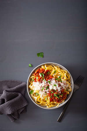 tagliatelle bolognese with herbs and parmesan, italian pastaの写真素材