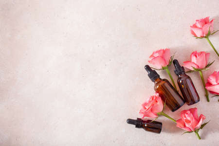essential oils in bottles rose flowers. alternative medicine aromatherapyの写真素材
