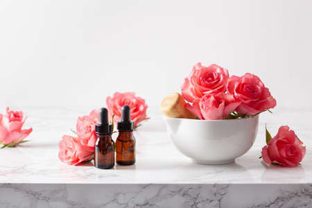 essential oils in bottles rose flowers. alternative medicine aromatherapyの写真素材