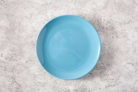 empty plate on concrete backgroundの写真素材