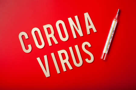 coronavirus word text wooden letter on red background corona virus covid-19の写真素材