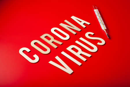 coronavirus word text wooden letter on red background coronavirus covid-19