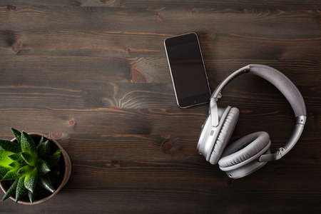 audiobook concept modern wireless headphones smartphoneの写真素材