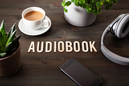 audiobook word text concept modern wireless headphones smartphoneの写真素材