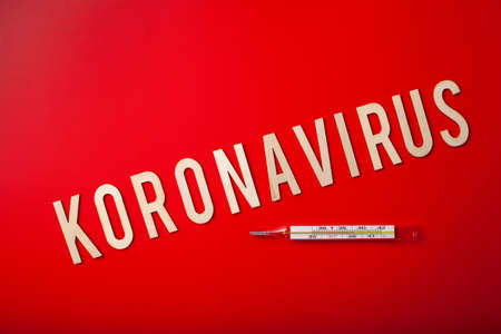 koronavirus norsk norwegian word text wooden letter on red background corona virus covid-19