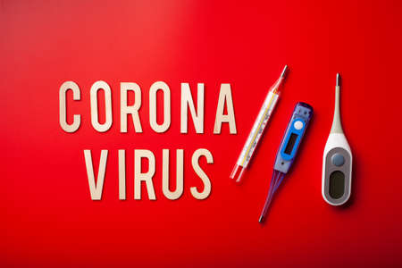 coronavirus word text wooden letter on red background corona virus covid-19