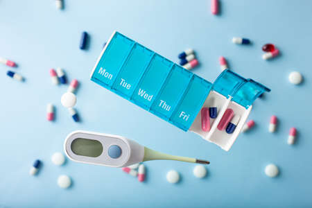 Flying pills on blueの写真素材