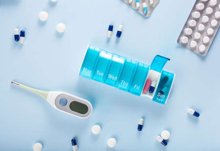 Pills capsule medicine on blue