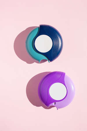 Asthma inhaler medicine on pink