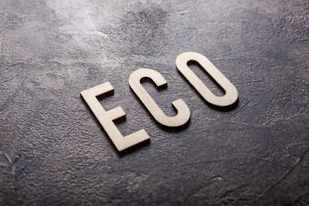 eco word text wooden letters on gray concrete backgroundの写真素材