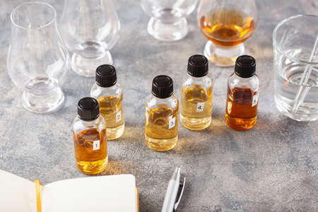 tasting whisky bottles and glasses or spirit brandy cognac. tasting at home