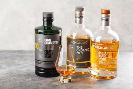 Trondheim, Norway - May 20 2020: Bruichladdich single malt scotch whisky three bottles and glass