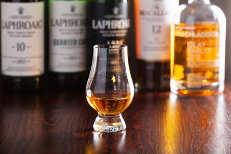 Trondheim, Norway - Mai 18 2020: Laphroaig single malt scotch whisky 10 years, quarter cask, lore, triple wood bottle and glassのeditorial素材