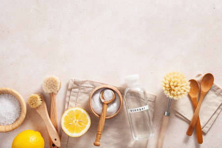 zero waste eco friendly cleaning concept. wooden brushes, lemon, baking soda, vinegarの写真素材