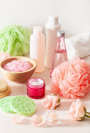 skincare products and rose flowers. natural cosmetics for home spa treatment