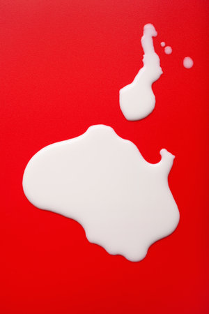 bad milk lactose intolerance allergy. milk splatter. avoid dangerous dairyの写真素材