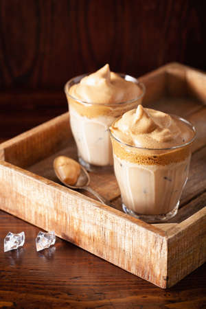 dalgona coffee in glass. trendy Instant coffee whipped with sugar and hot waterの写真素材