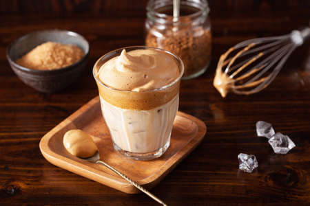 dalgona coffee in glass. trendy Instant coffee whipped with sugar and hot waterの写真素材