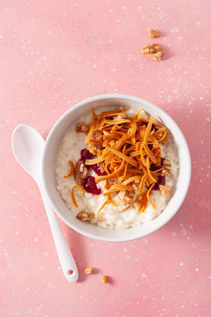 rice pudding with Norwegian brunost traditional brown cheese and raspberry jam