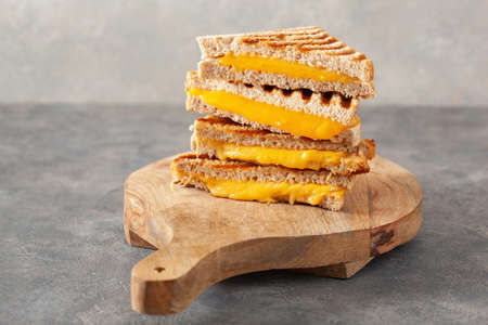grilled cheese sandwich on gray concrete backgroundの写真素材