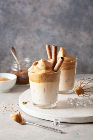 dalgona coffee in glass. trendy Instant coffee whipped with sugar and hot waterの写真素材