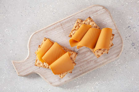 crispbread with Norwegian brunost traditional brown cheeseの写真素材