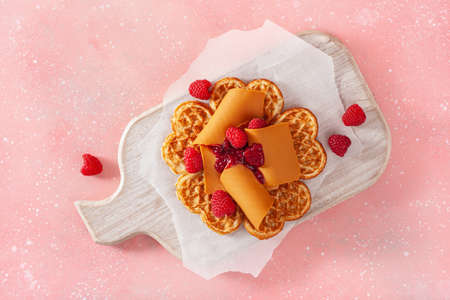 waffles with Norwegian brunost traditional brown cheese and raspberry jamの写真素材