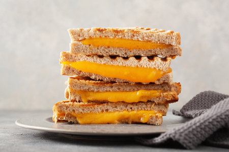 grilled cheese sandwich on gray concrete backgroundの写真素材